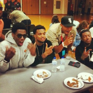 Ryan with rap group Travis Porter at NIU. 